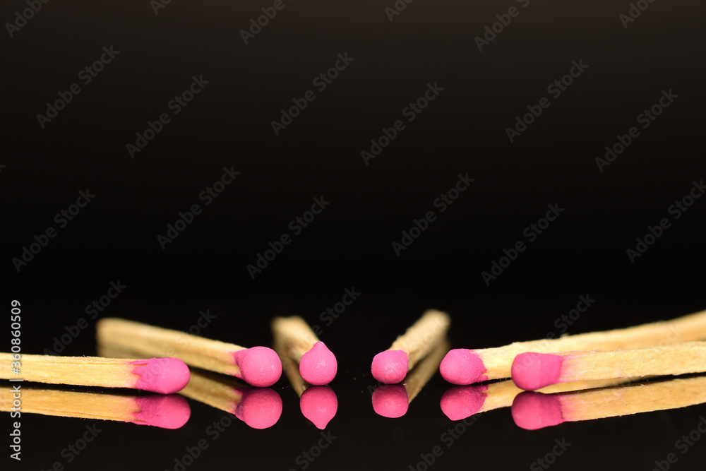 Matches made of wood, close-up, on a black background. Matches made of wood, close-up, on a black background.