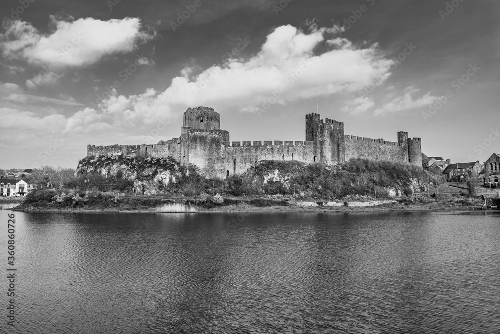 Pembrokeshire, Wales, UK: Landscape with the ruins of old medieval Pembroke Castle on the shores of river Pembroke, the original family seat of the Earldom of Pembroke