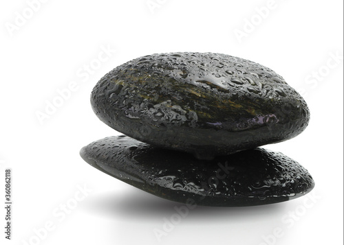 Stacked black river rocks