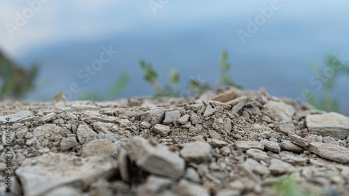Small stones, soil near the pond. High quality photo