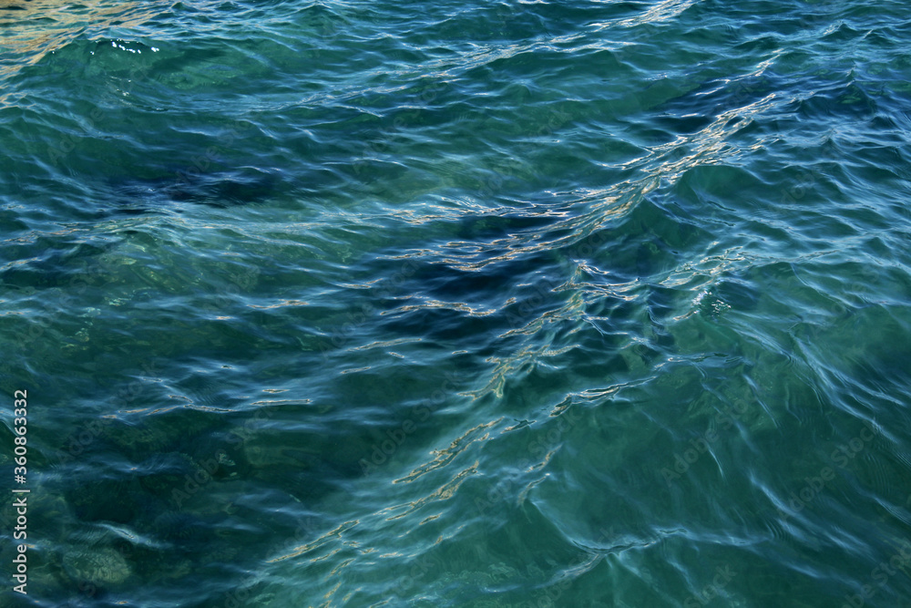 Naklejka premium Blue sea close-up. Background. Texture. Substrate.