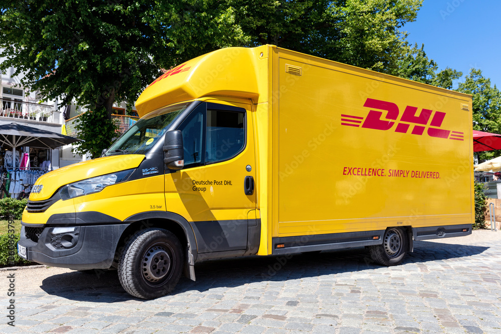 ROSTOCK, GERMANY - JUNE 15, 2020: DHL delivery van. DHL is a division of  the German logistics company Deutsche Post AG providing international express  mail services. foto de Stock | Adobe Stock