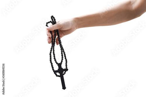 Hand holding Christian cross isolated on white background. Object with clipping path. Crucifix, Symbol of Faith.