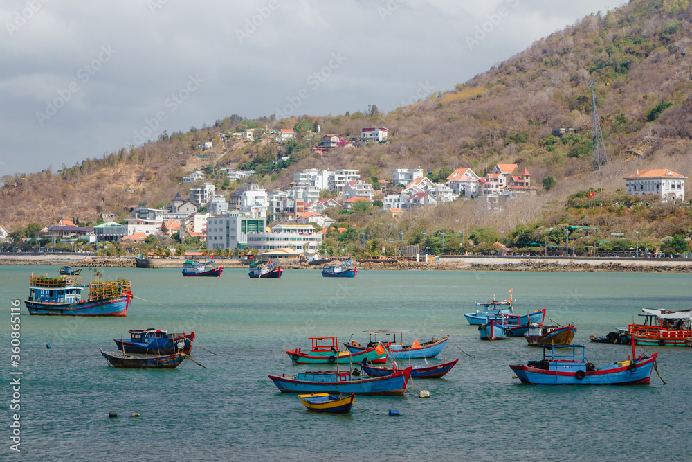 Colorful local fishing boats anchored in the bay at Vung Tau, Vietnam