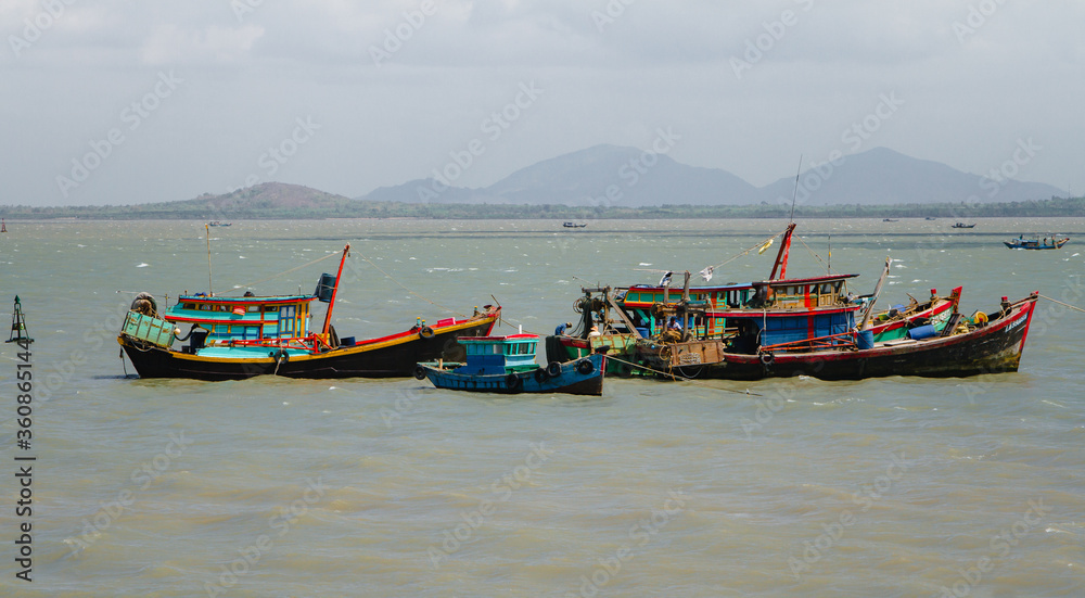 Colorful local fishing boats anchored in the bay at Vung Tau, Vietnam