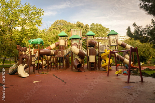 Wallpaper Mural a big toy tunnel sliders in the playground, park without people. Torontodigital.ca