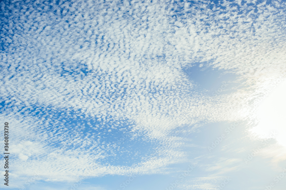 Grainy clouds in the blue sky