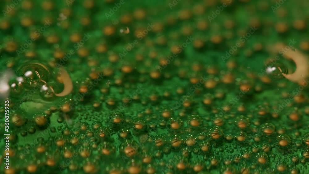 Copper. Copper oxidation process. Green bubbles close up. Chemical