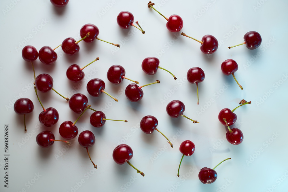 Group of cherry on a white background with shadows. Close-up. Top view. Group of cherry on a white background with shadows. Close-up. Top view.