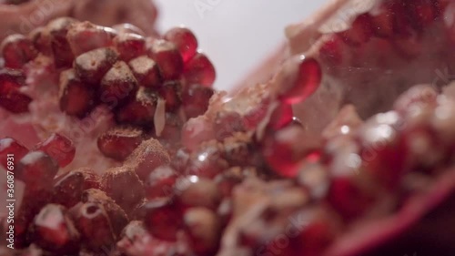 Pomegranate close-up. Wiring slider. garnet is sprinkled with gold dust. kandurin photo