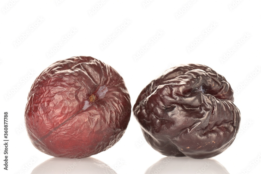 Dry plum, macro, on a white background. Dry plum, macro, on a white background.
