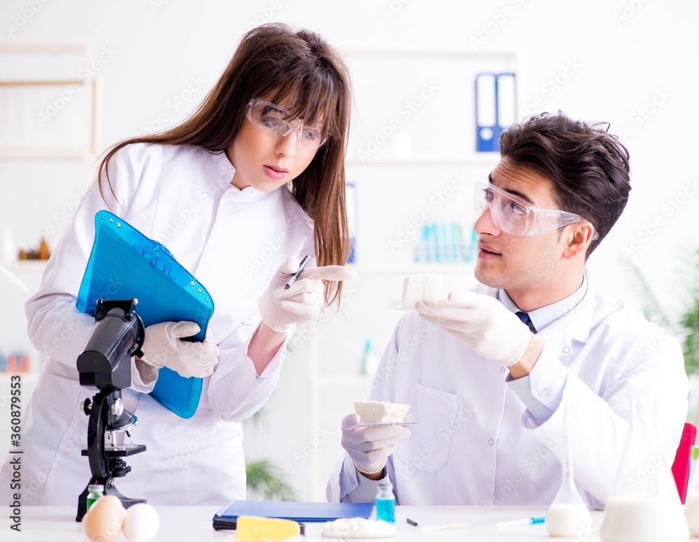 Two lab doctor testing food products Two lab doctor testing food products
