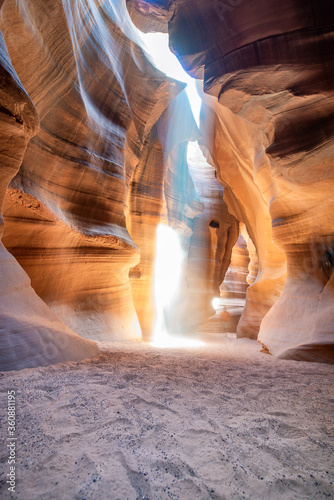 Beautiful wide angle view of sandstone formations in famous Antelope Canyon on a sunny day filtering light rays, Page, American Southwest, Arizona, USA