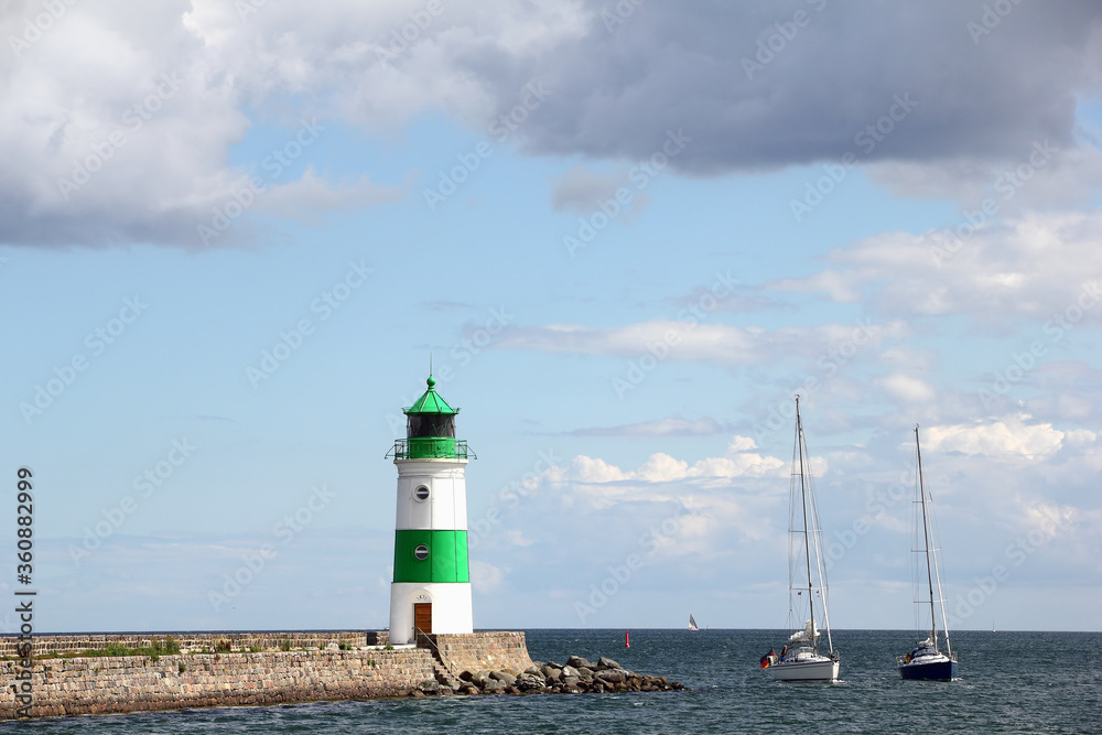 Lighthouse of Schleimünde at Western coast of Baltic Sea and Sailing boats Lighthouse of Schleimünde at Western coast of Baltic Sea and Sailing boats