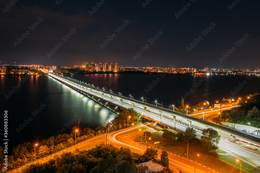 Fototapeta premium Night Voronezh. Northern bridge over Voronezh river, aerial view