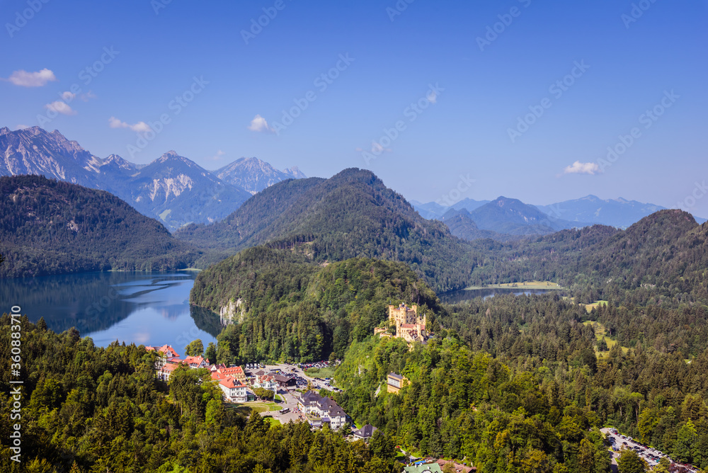 Aerial view on Hohenschwangau castle surrounded by mountains and lake