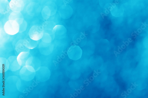 abstract defocused blue bokeh sparkling light glitter background. for wallpaper backdrop and template.