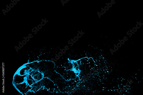 Blue color paint splash isolated on black background