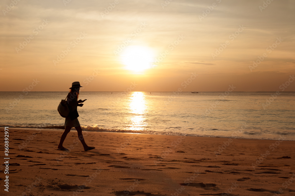 Woman walking at the beach