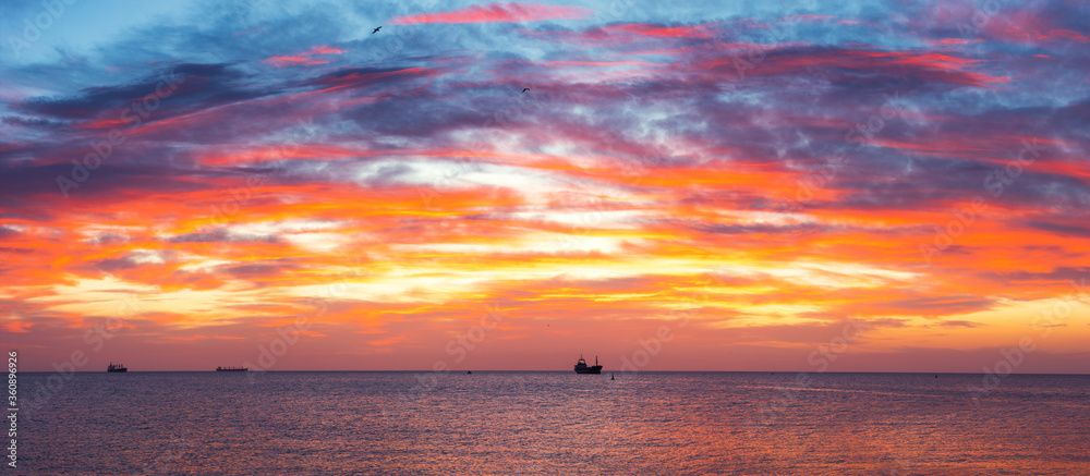 Cargo ship with containers in sunrise light Cargo ship with containers in sunrise light