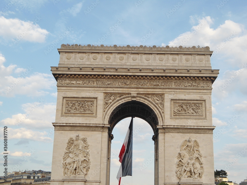 Outside view of Arc de Triomphe with French Flag, Paris, France 2011