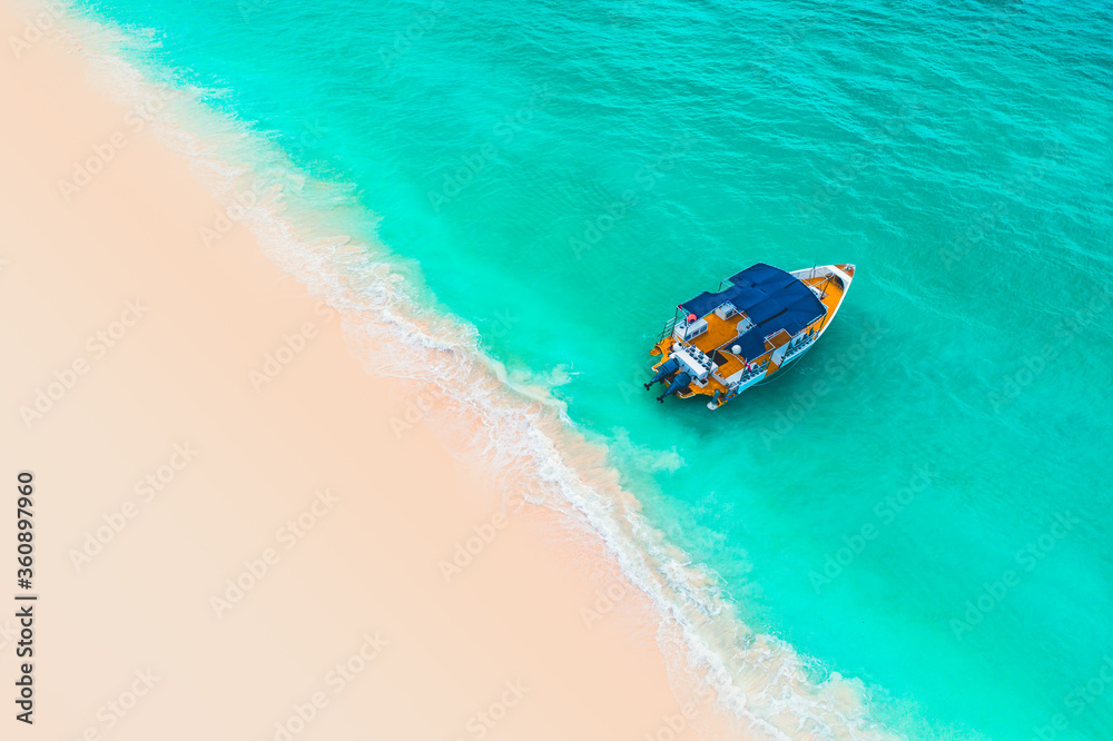 Beautiful caribbean sea and boat, aerial view from the beach