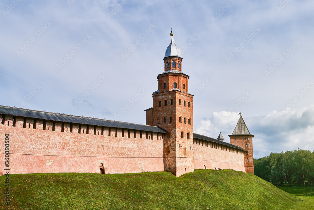 Detinets or Novgorod Kremlin red brick fortress walls. Kokui watchtower in summer day in Veliky Novgorod, Russia. Travel concept, copy space Detinets or Novgorod Kremlin red brick fortress walls. Kokui watchtower in summer day in Veliky Novgorod, Russia. Travel concept, copy space