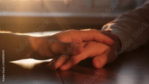 Male hand stroking male hand as a sign of support and understanding, close-up. Support and reciprocity in a gay couple concept
