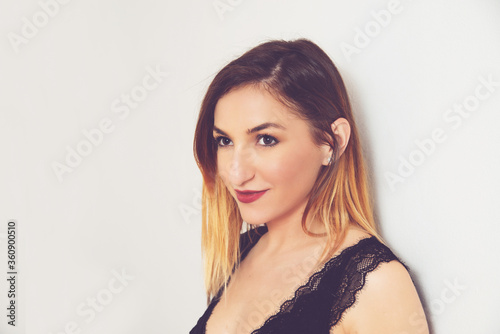 Young beautiful woman dressed in black lingerie. She Smiley.