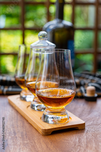 Tasting of Scotch whisky in traditional old British house with wooden windows © barmalini