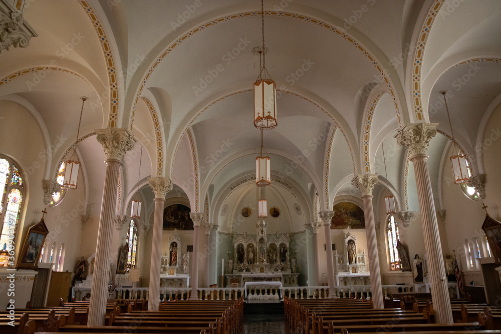 Catholic Church interior with gorgeous arches and beautiful pews