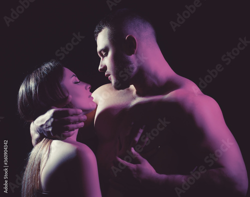 Canvas-taulu Photo of seductive hot woman and brutal big muscular tender guy with bristle is looking at woman's eyes