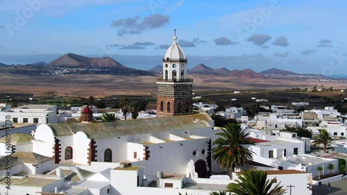 Spain, Canary Islands, Lanzarote, Teguise, Church of Our Lady of Guadalupe and Volcanic mountain landscape photo
