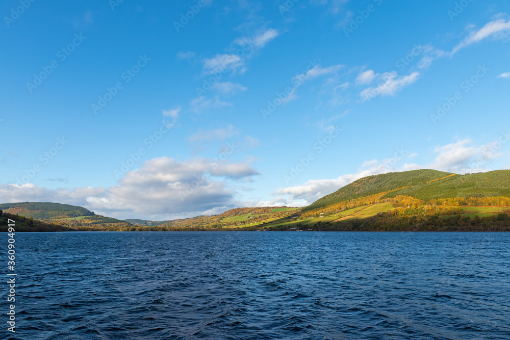Blue sky over the legendary Loch Ness lake on a sunny autumn day