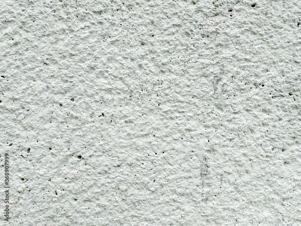 Texture of rough white decorative plaster. Background of the old concrete wall. White grunge texture. Top view on gray cement texture background.