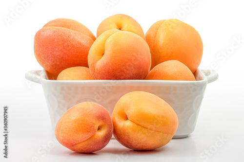 fresh apricots in a bowl isolated