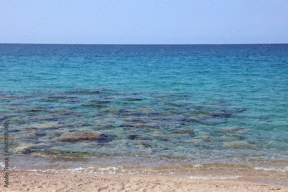 pristine sea with the stony sand of the Mediterranean island in pristine sea with the stony sand of the Mediterranean island in