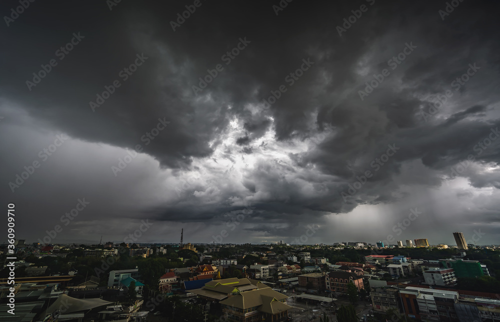 CHIANG MAI, THAILAND - JUNE 19, 2020 : Dark sky with stormy gray clouds just before rain falling in Chiang Mai City in Thailand..