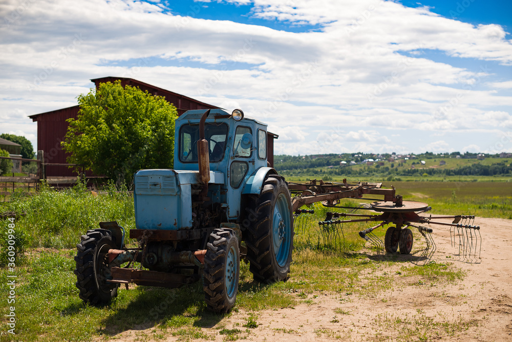 Fototapeta premium blue tractor in the field