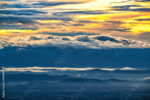 Misty fog and sunlight morning on Doi Suthep mountain important Landmark Travel Place of Chiang Mai, Thailand