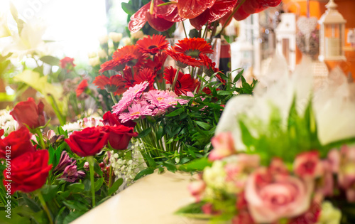 Flower shop with huge arrenge of flowers and lovely roses, floristics concept