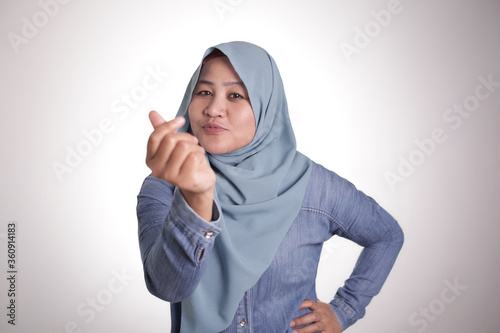 Muslim Woman Doing Money Gesture