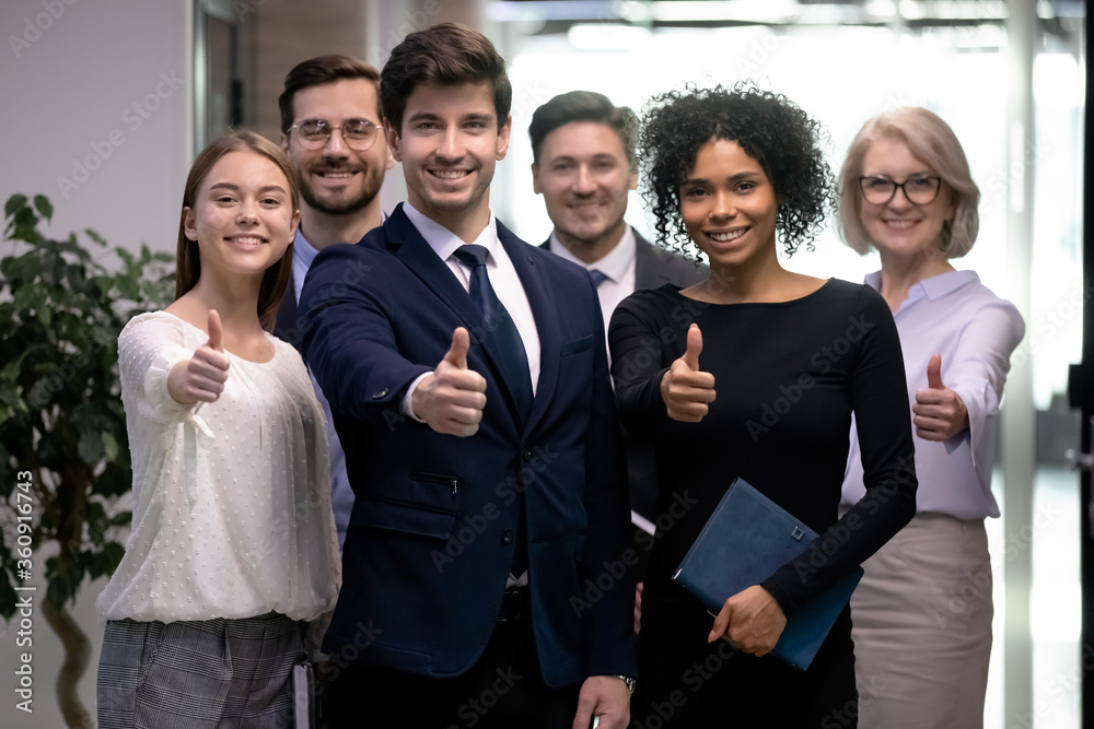 Portrait of happy businesspeople diverse group showing thumbs up. Successful multi ethnic business team happy smiling with recommendation sign. Portrait of mixed race coworkers cheering to success Portrait of happy businesspeople diverse group showing thumbs up. Successful multi ethnic business team happy smiling with recommendation sign. Portrait of mixed race coworkers cheering to success