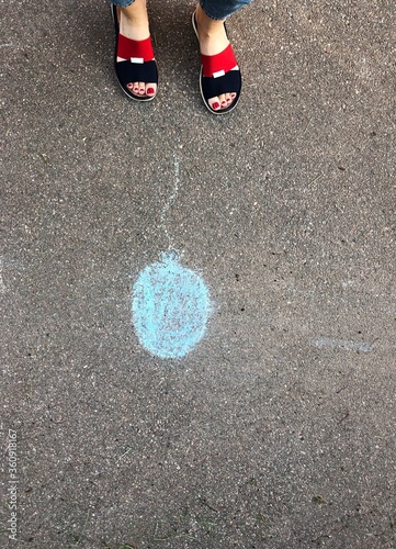 Blue balloon drawn on the asphalt view
