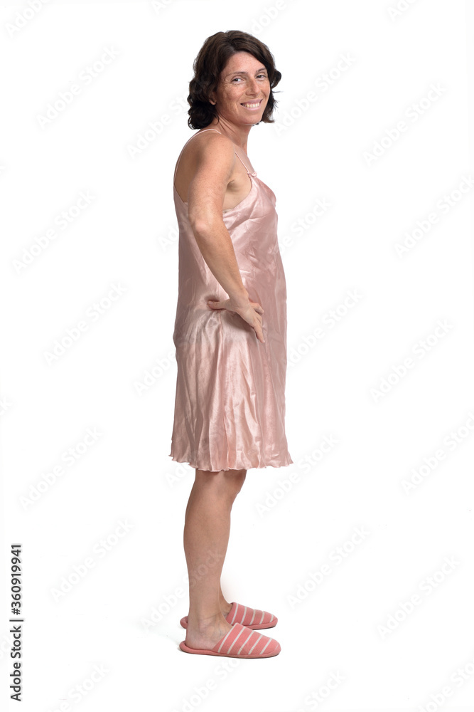 side view of summer nightgown on white background, hands on hip looking at camera