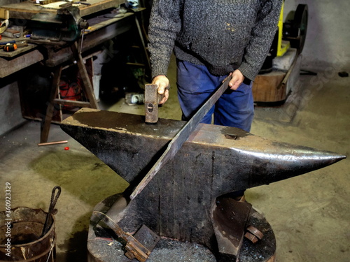 Blacksmith at work in anvil