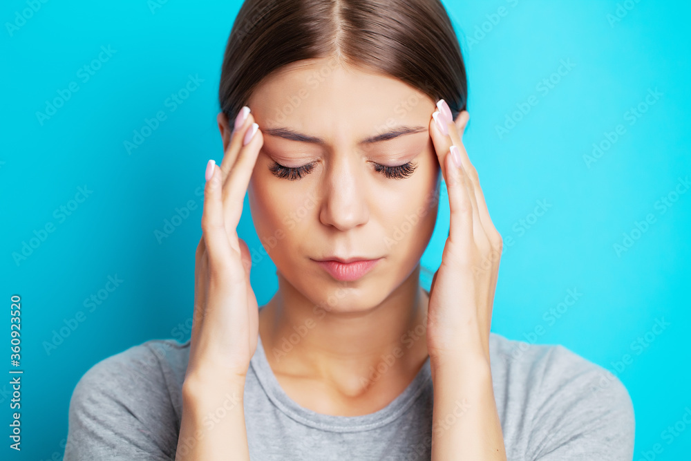 Head pain, exhausted young woman has suffering from unbearable headache Head pain, exhausted young woman has suffering from unbearable headache