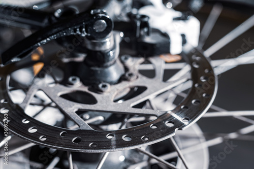 Close-up of a spoke wheel. Macro photo. Part of the bike.