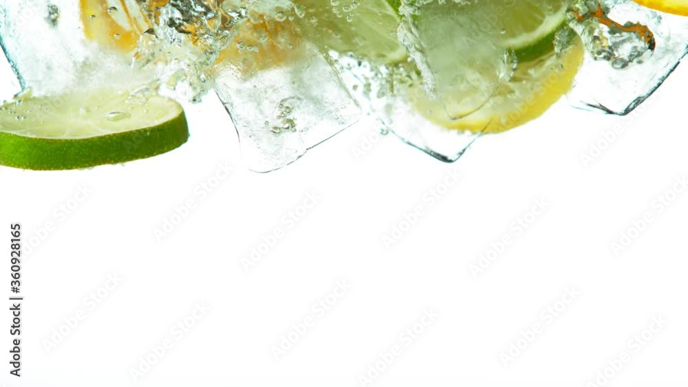 Super slow motion of limes, oranges and lemons with water splash on white. Filmed on high speed cinema camera, 1000 fps.