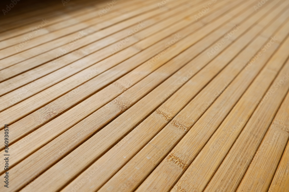 Side angle of wooden texture. Using natural materials in interior design. Yellow window sill surface at home. Decorative pattern in modern house flooring. Long thin geometric lines in natural light.